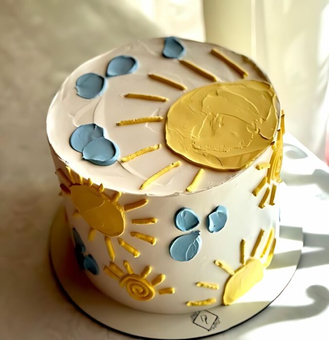 Sunshine-Themed Cake with Handcrafted Yellow Sun and Blue Clouds