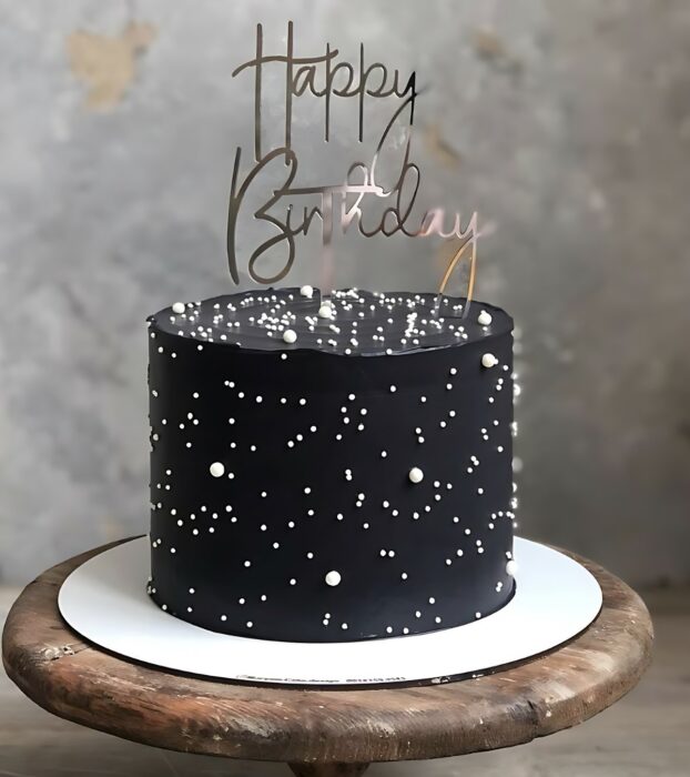 Black Birthday Cake with Starry White Accents and Custom Topper