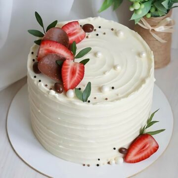 Elegant White Frosting Cake with Fresh Strawberries