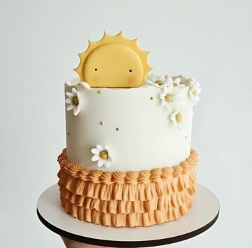 Sun-Themed Cake with Daisy Decorations and Ruffled Base