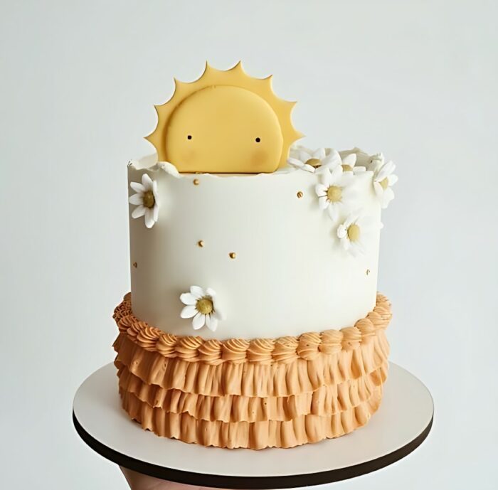 Sun-Themed Cake with Daisy Decorations and Ruffled Base