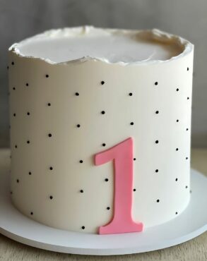 Minimalist 1st Birthday Cake with Pink Number and Polka Dots
