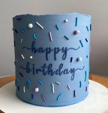 Blue Birthday Cake with Sprinkles and Handwritten Design