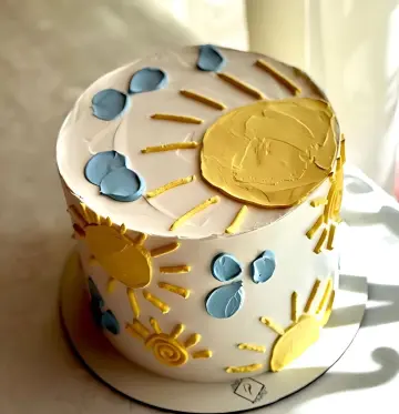 Sunshine-Themed Cake with Handcrafted Yellow Sun and Blue Clouds