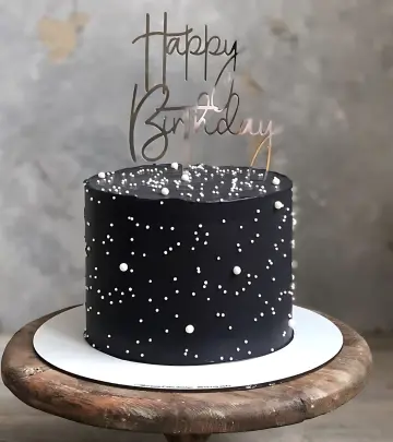 Black Birthday Cake with Starry White Accents and Custom Topper