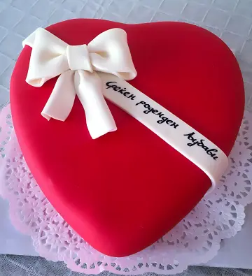 Heart-Shaped Red Cake with White Bow