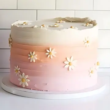 Pink Ombré Daisy Cake with Delicate Floral Accents
