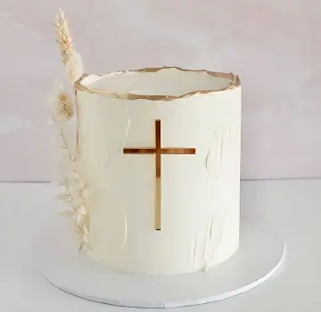 Elegant White Cake with Gold Cross Design and Dried Florals